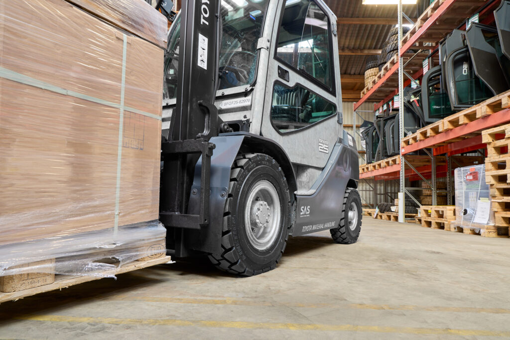A forklift truck in a warehouse fitted with the KENDA K610 Kinetics