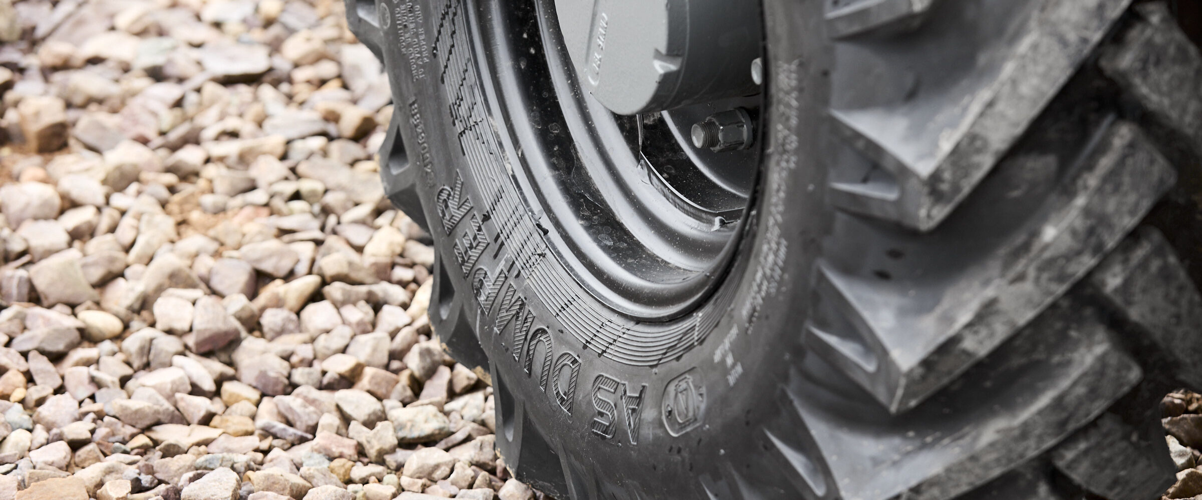 STARCO dumper tire tread close-up on Thwaites machine